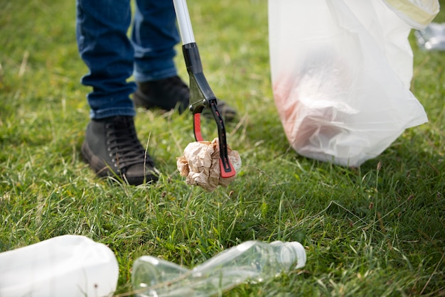 Free photo person doing community service by collecting trash