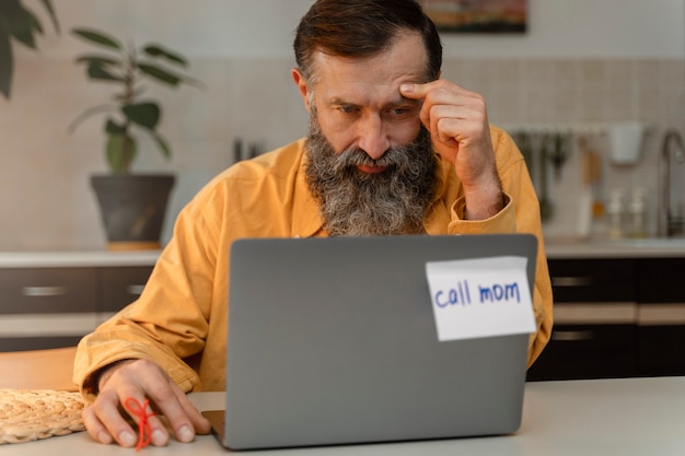 Free photo person doing day-to- day activity while waring string on finger to remember something important