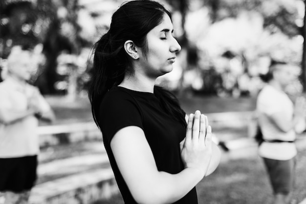 Free photo person doing yoga at the park