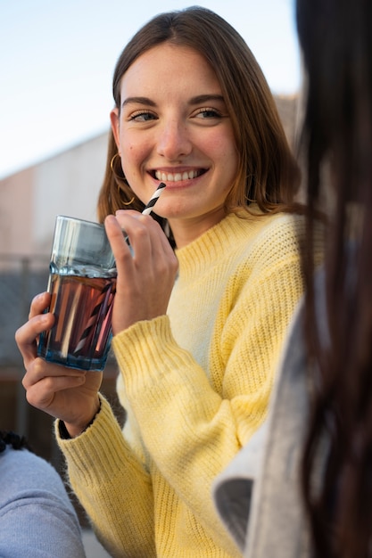 Free photo person drinking kombucha