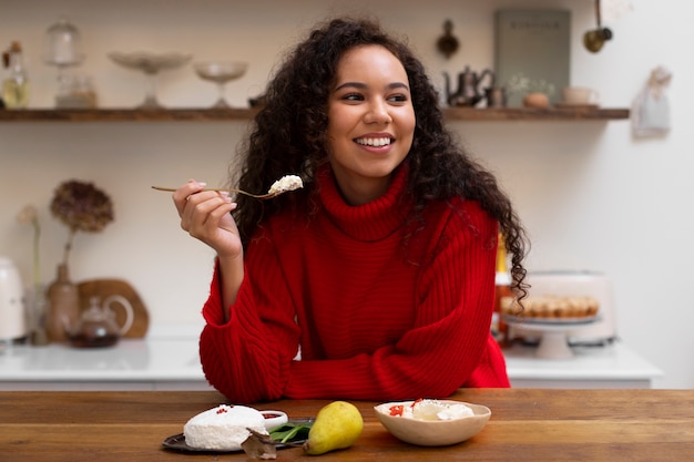 Free photo person eating fresh cheese