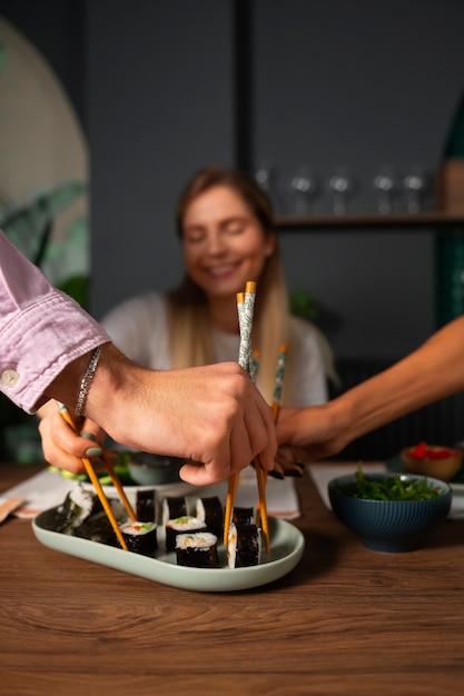 Free photo person eating seaweed snacks