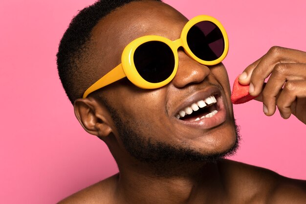 Free photo person eating a sweet candy desert