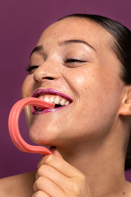 Free photo person eating a sweet candy desert