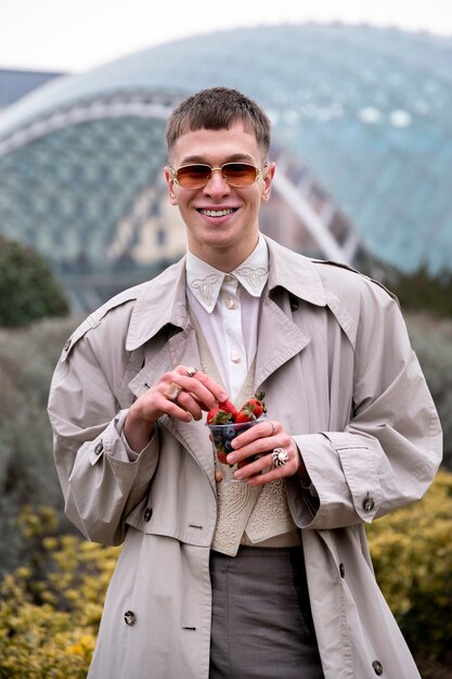 Person enjoying a berry snack outdoors