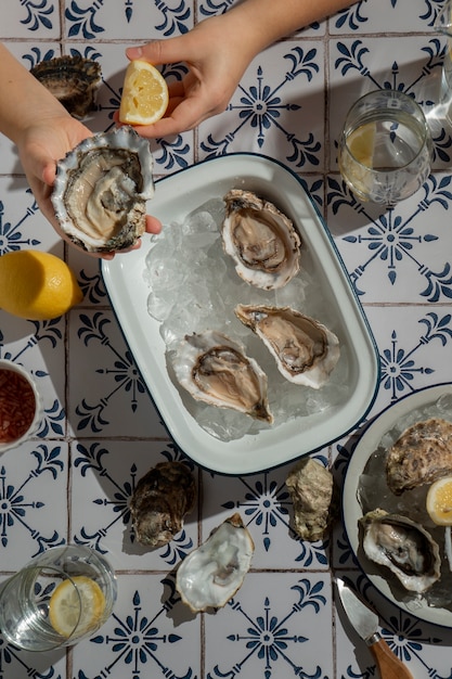Free photo person enjoying a dish made of oysters