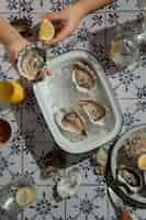 Free photo person enjoying a dish made of oysters