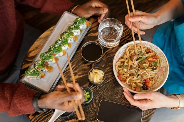 Person enjoying food at restaurant