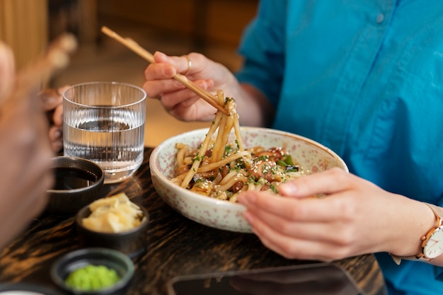 Person enjoying food at restaurant