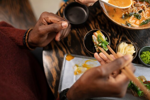 Person enjoying food at restaurant