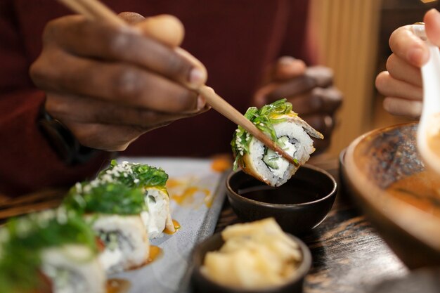 Person enjoying food at restaurant