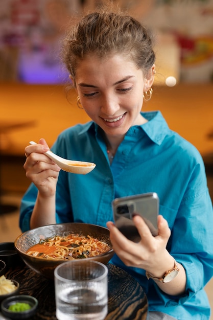 Person enjoying food at restaurant
