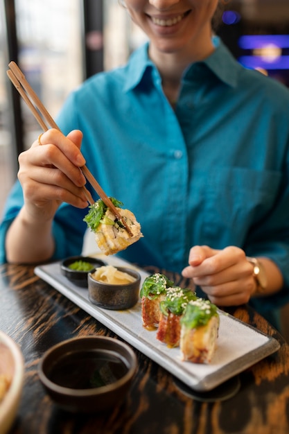 Person enjoying food at restaurant