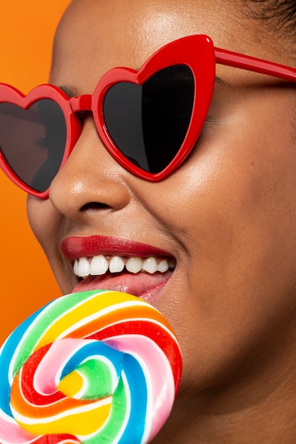 Free photo person enjoying lollipop candy