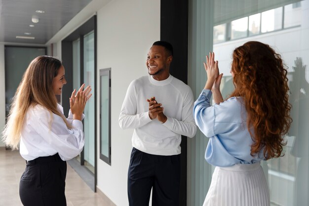 Person expressing appreciation to their workmates