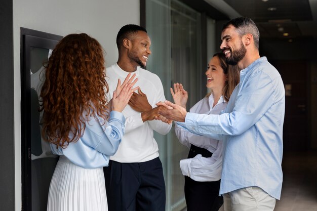 Person expressing appreciation to their workmates