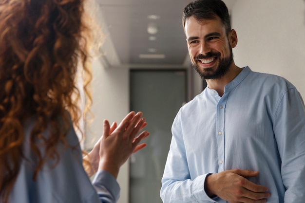 Person expressing appreciation to their workmates