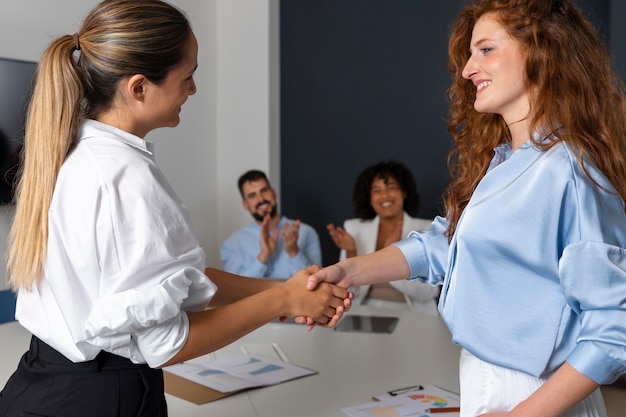 Person expressing appreciation to their workmates