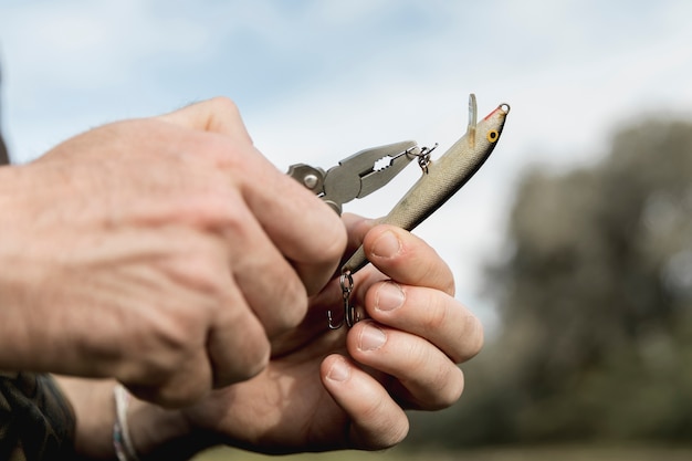 Person fixing a fish hook