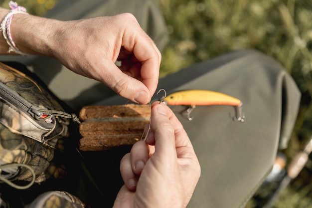 Person fixing a fish hook