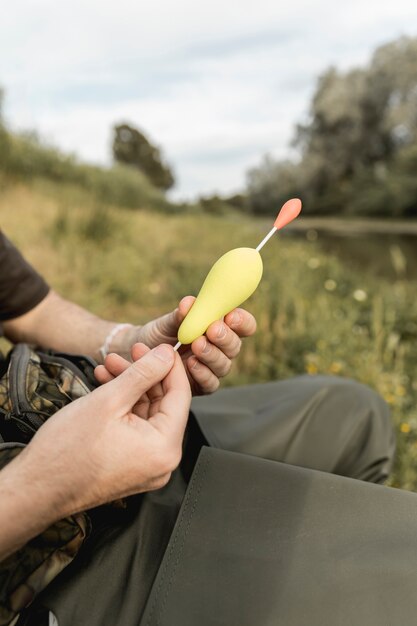 Person fixing a fish hook