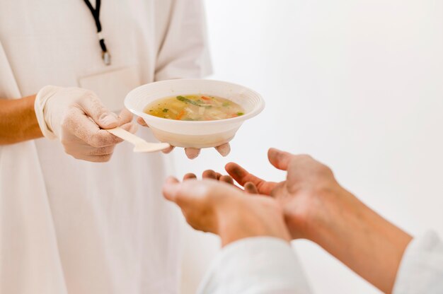 Person getting bowl of soup