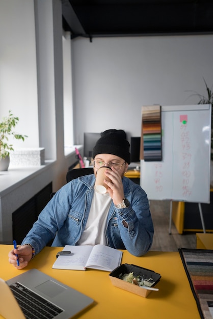 Free photo person getting break time at office