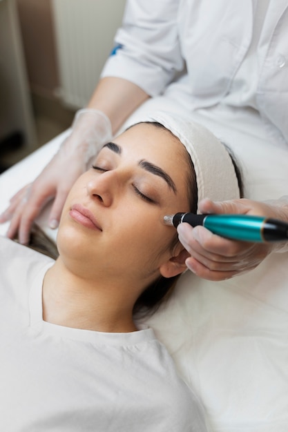 Person getting micro needling beauty treatment