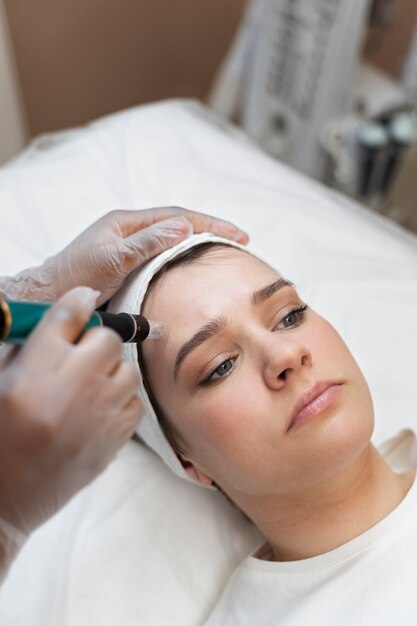 person getting micro needling beauty treatment