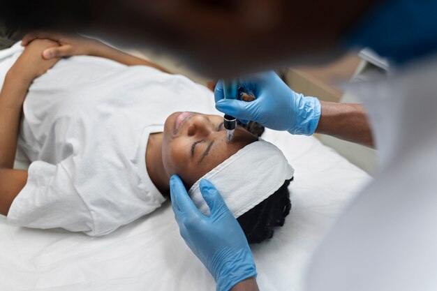 Person getting micro needling beauty treatment