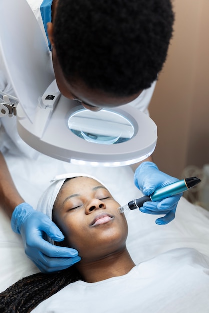 Person getting micro needling beauty treatment