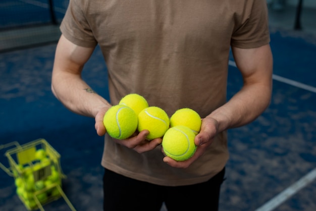 Free photo person getting ready to play paddle tennis inside