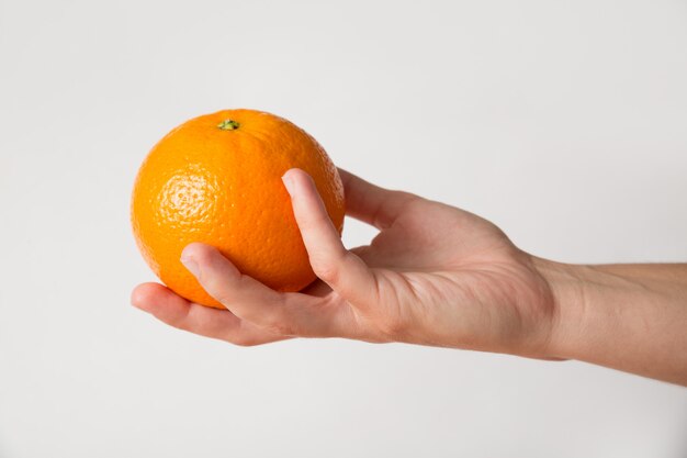 Person giving orange