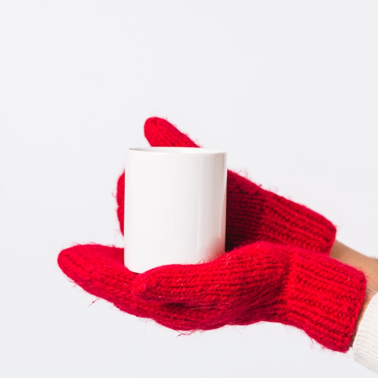 Free Photo person in gloves holding cup