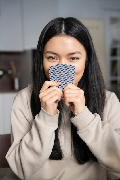 Free photo person having fun while playing poker with friends