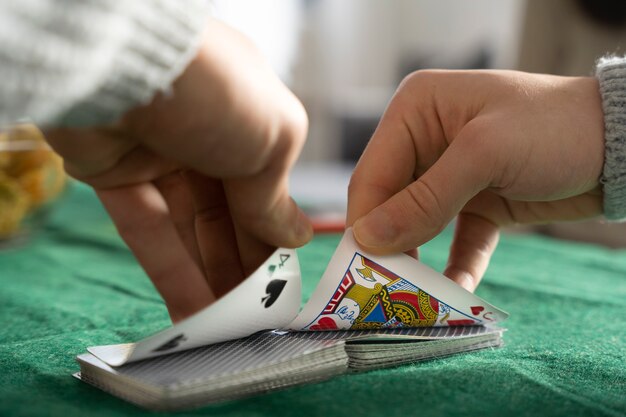 Person having fun while playing poker with friends