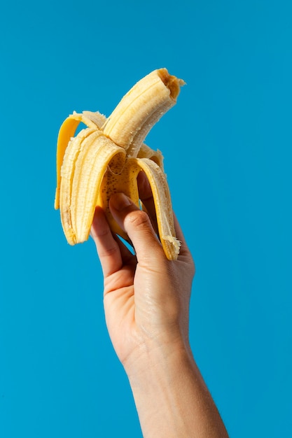 Person holding a banana