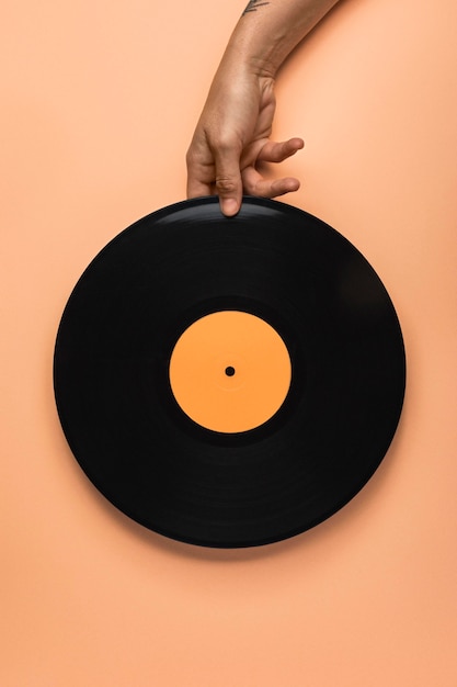 Person holding a black vinyl