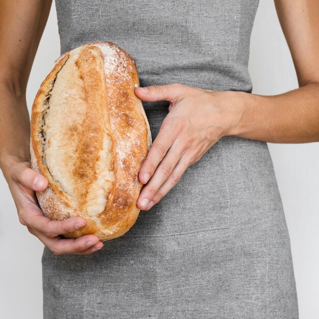 Person holding bread loaf