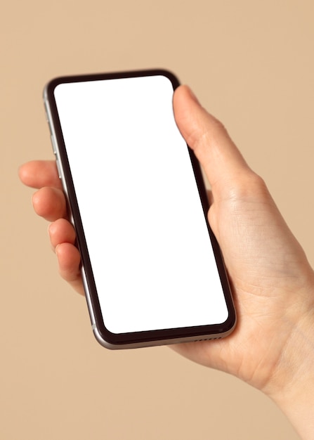 Free photo person holding a copy space mobile phone