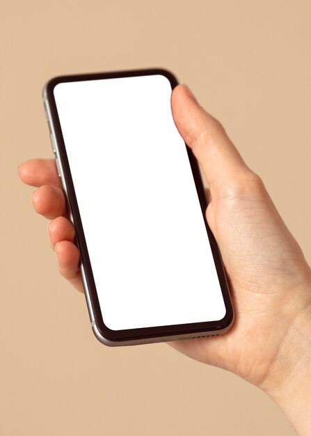 Person holding a copy space mobile phone