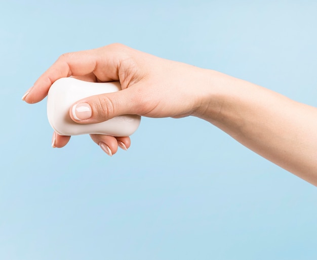 Person holding a disinfection bottle