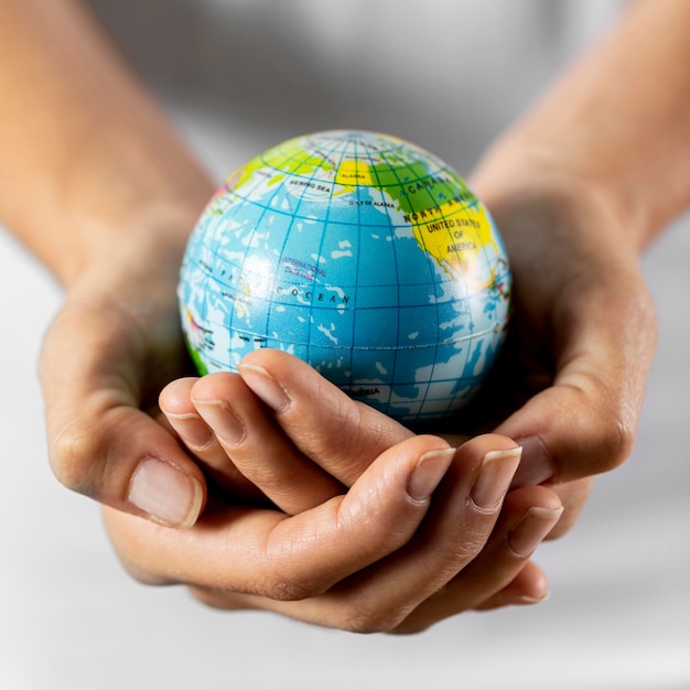 Person holding earth globe