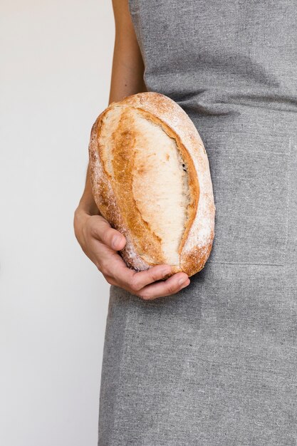 Person holding freshly baked bread
