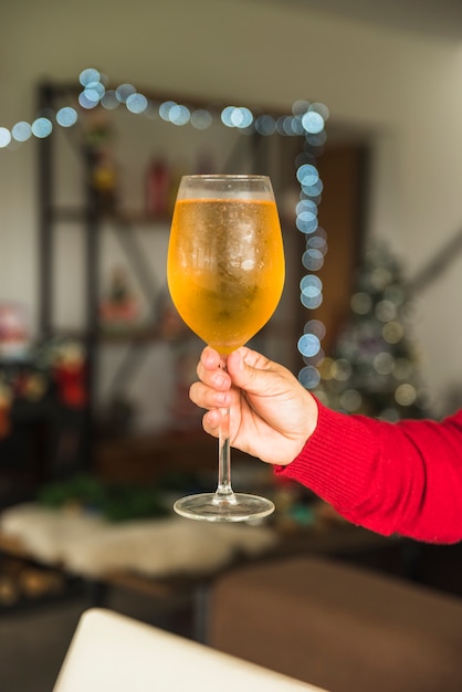 Free photo person holding glass of wine