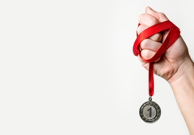 Person holding his number one medal