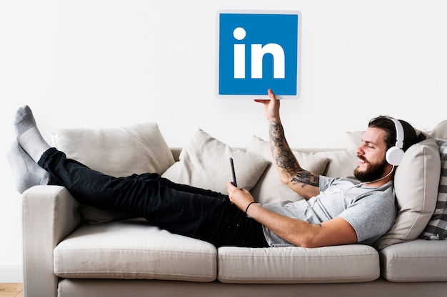 Free photo person holding a linkedin icon