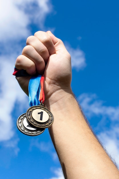 Person holding medals