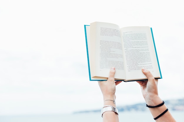 Free photo person holding an open book