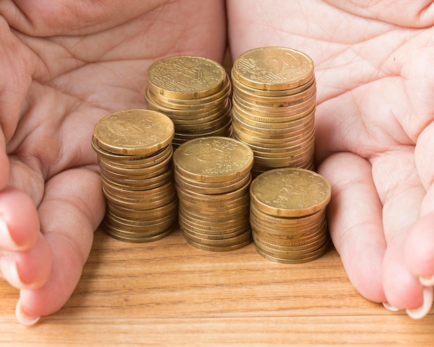 Person holding a pile of coins